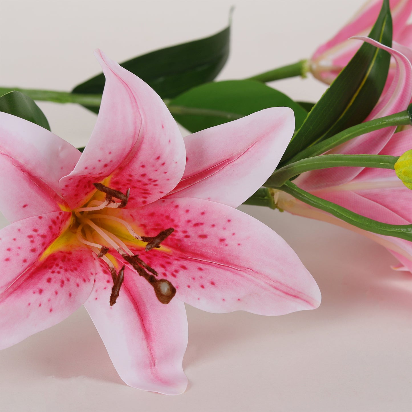 Realistic artificial pink lily flower petals close up detail