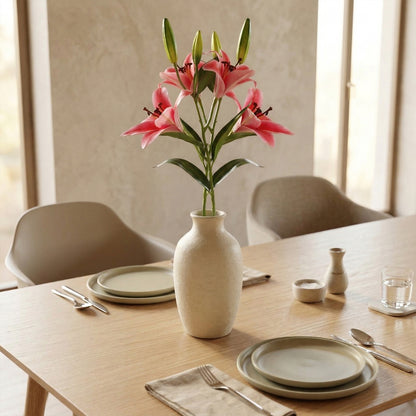 Artificial pink lily flowers in vase dining table centerpiece decor
